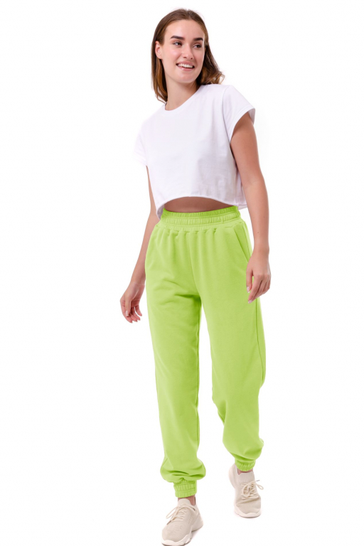 Штани вільного крою с манжетом на резинці внизу у кольорі лайм