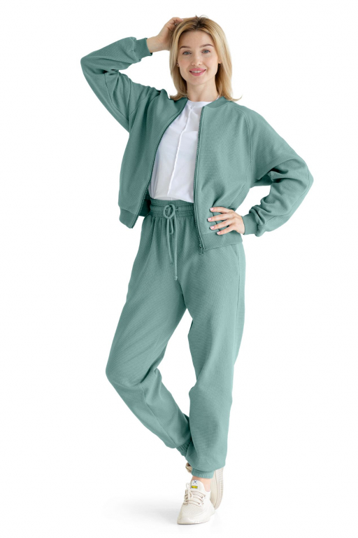 Бомбер з рукавом реглан у з двома кишенями у швах смарагдово - зеленого кольору