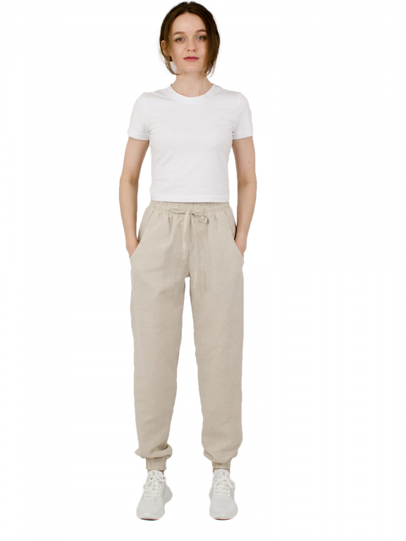 Штани вільного сілуету з манжетами на резинці та шнурком у поясі бежевого кольору